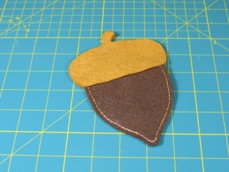 Placing cap pieces on acorn.