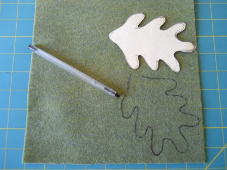 Tracing leaf template onto felt.