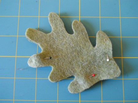 Pinning leaf sections together before sewing.