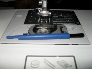 Sewing machine needle tool.