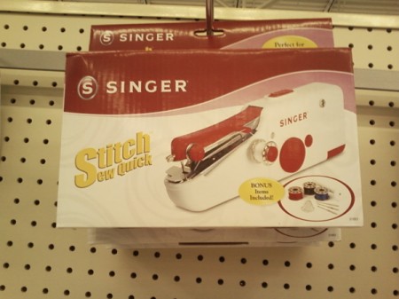 Singer hand held sewing machine.