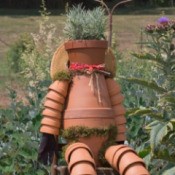 Recycled garden art. A man made from recycled clay pots.