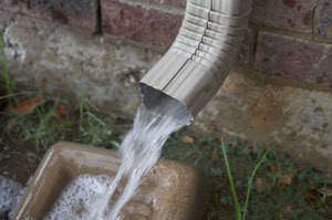 A rain downspout with runoff