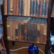 Encyclopedias on bookshelf.