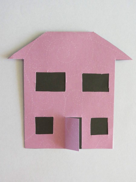 Glue black paper to back side of house.