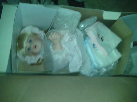 Doll in box.