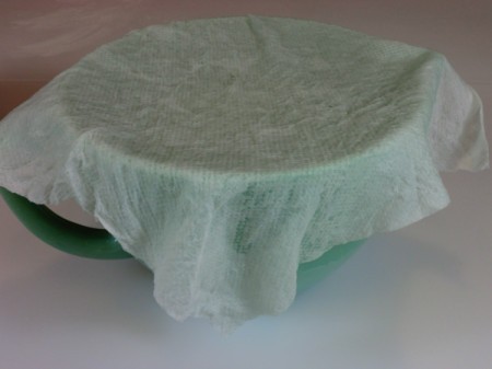 damp towel over dough