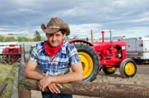 A photo of a cowboy on a farm.