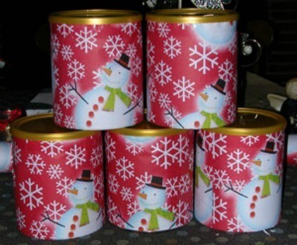 A photo of formula cans used to store gifts.