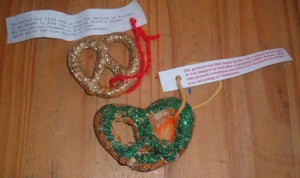 Pretzels decorated with glitter and tied with the paper tag.