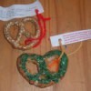 Pretzels decorated with glitter and tied with the paper tag.