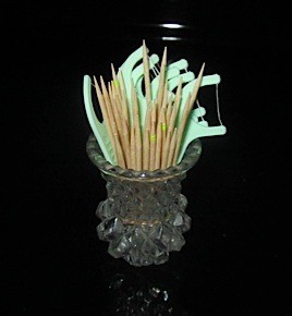 Both types of toothpicks in glass holder.