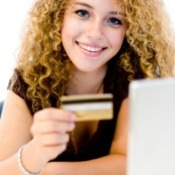 A girl college student with a credit card.