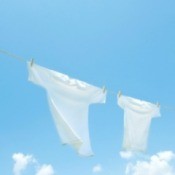 White t-shirts hanging on a clothesline.