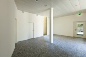 A photo of a large room with granite floors.