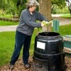 Woman using a composter