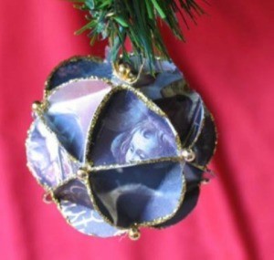 Faceted paper ornament made from recycled Christmas cards.