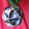 Faceted paper ornament made from recycled Christmas cards.
