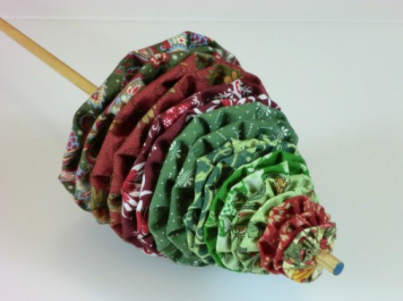 Ready to glue last yo yo on at top.