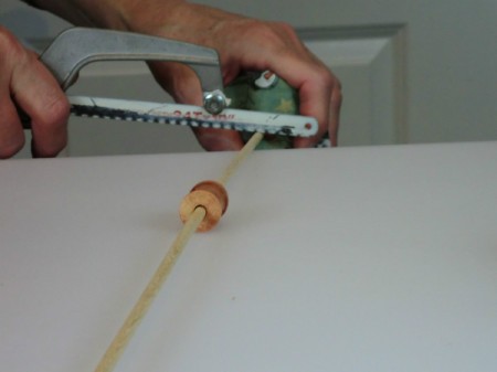 Cutting dowel to length.