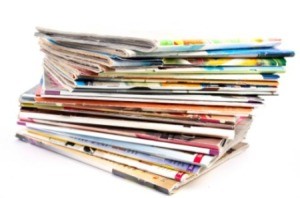 A large stack of food magazines.