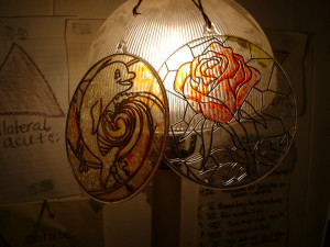 Displaying Children's Plastic Stained Glass Crafts - two plastic  stained glass circles on lamp shade