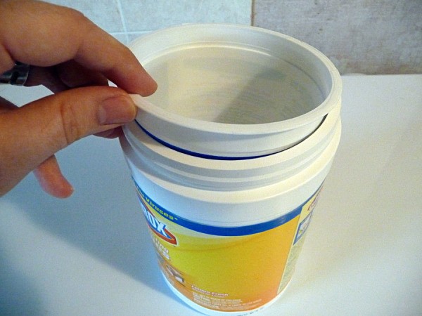 placing yogurt container in wipes container