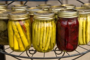 Canning jars of preserved vegetables