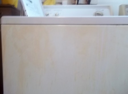 Yellow stains on front of washer.
