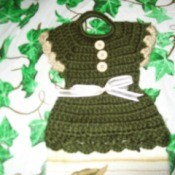 Crochet dress tea towel topper.