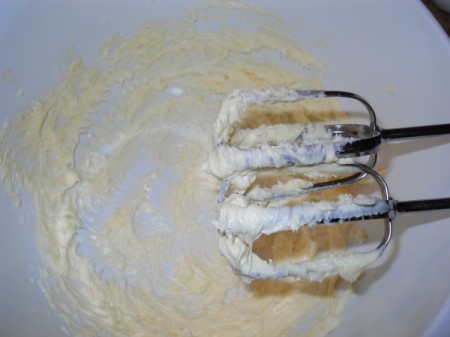 Whipping butter until fluffy.