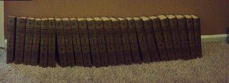 Set of encyclopedias on carpet.