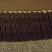 Set of encyclopedias on carpet.