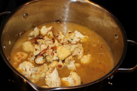 adding roasted cauliflower