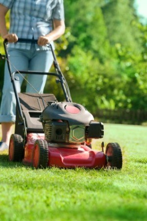 A person mowing the lawn