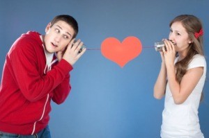 Young Man and Woman Talking Through Tin Can