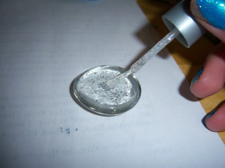 Applying glitter polish.