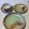 Dishes from set. Cup and saucer, plate, and serving plate.