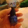 Bottle of blue nail polish.