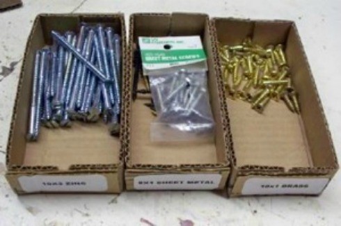 Homemade boxes for organizing small parts.