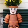 terra cotta flower pot person