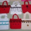 Red and white decorated mini tote bags.