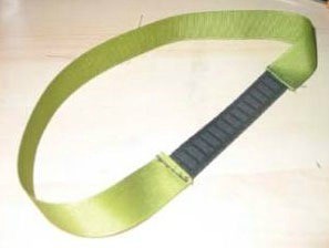 Green ribbon headband with elastic section.