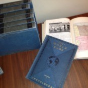 Stack of blue covered encyclopedias.