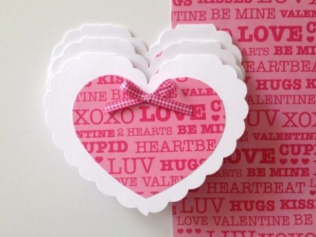Smaller pink heart attached to scalloped background heart.