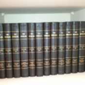 Blue bound encyclopedias on a shelf.