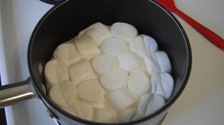 Marshmallows and butter in pan.