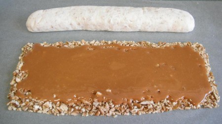 Caramel mixture poured over pecans.