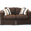 Upholstered couch with soft cushions.