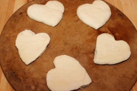 dough hearts on baking stone